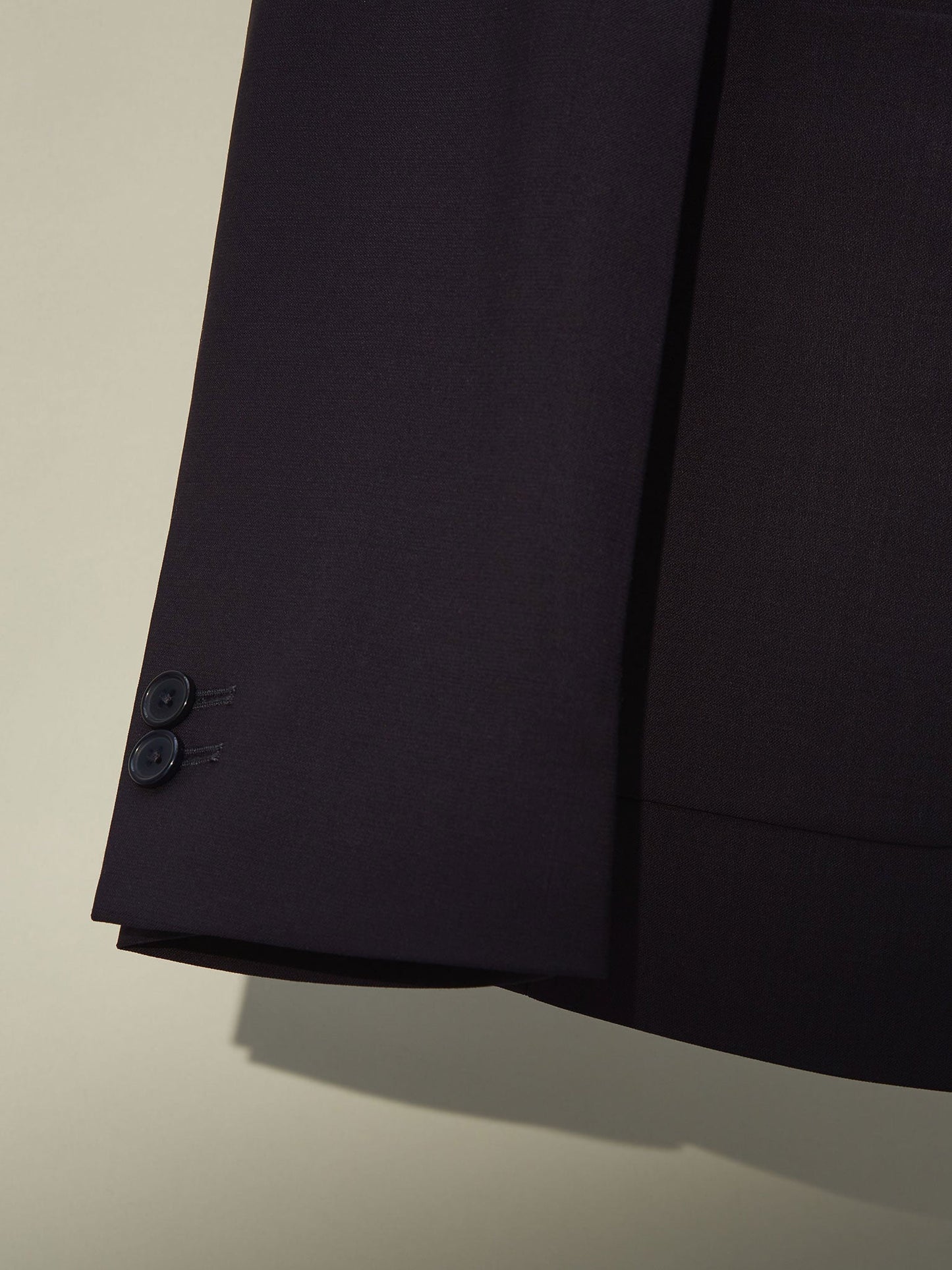 Sophisticated blue blazer for men with fine texture and contrast buttons