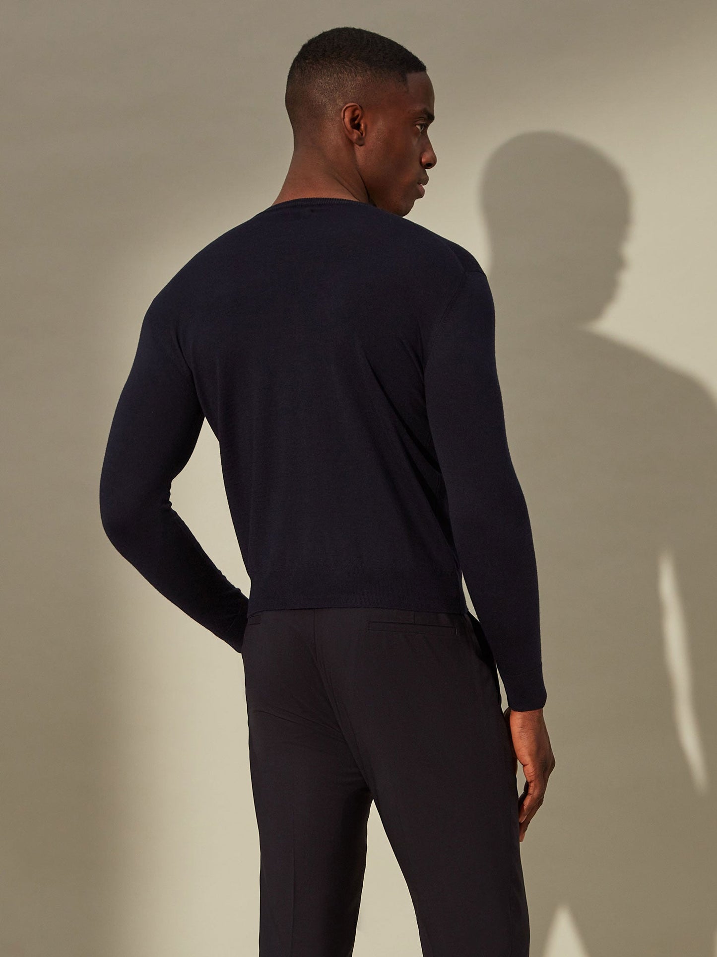 blue merino jumper, perfect for leisure or travel.