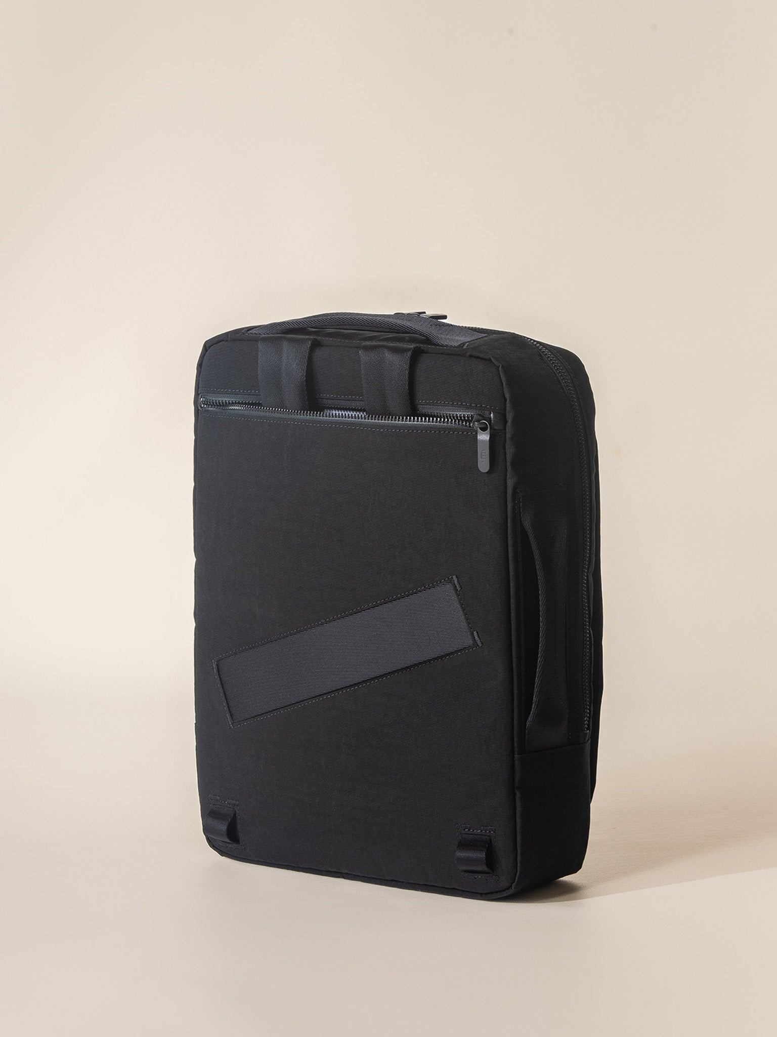 A sleek and durable black travel backpack, made of high-quality materials and designed for comfort and convenience