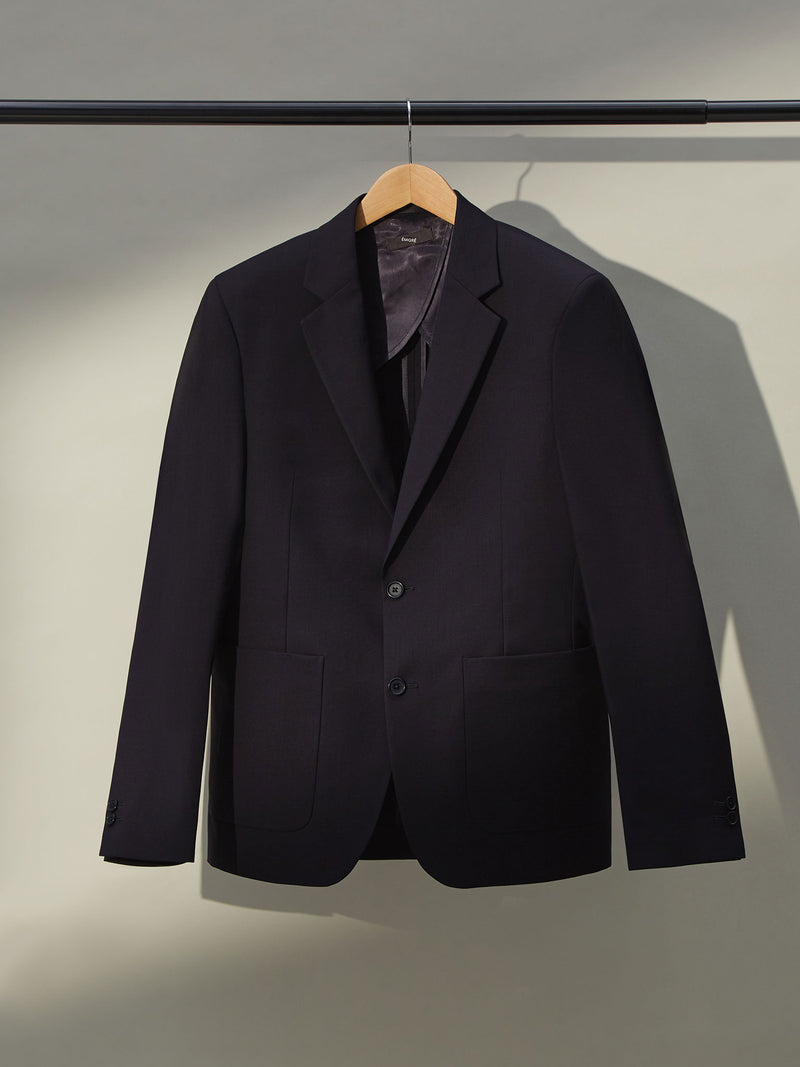 Versatile men's blue blazer with notch lapels and two-button front closure