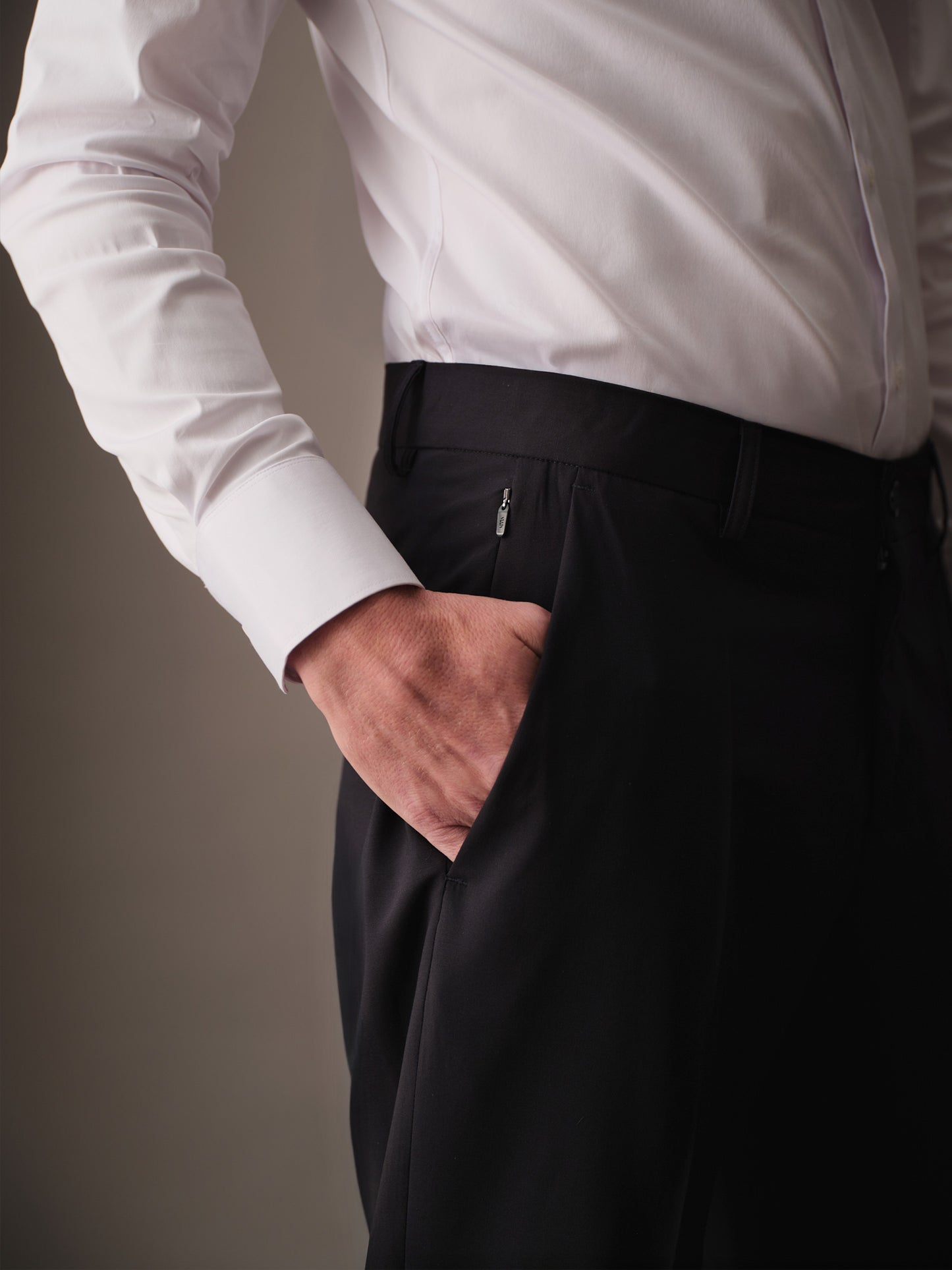 Side pocket detail with concealed zipper on modern pants for men