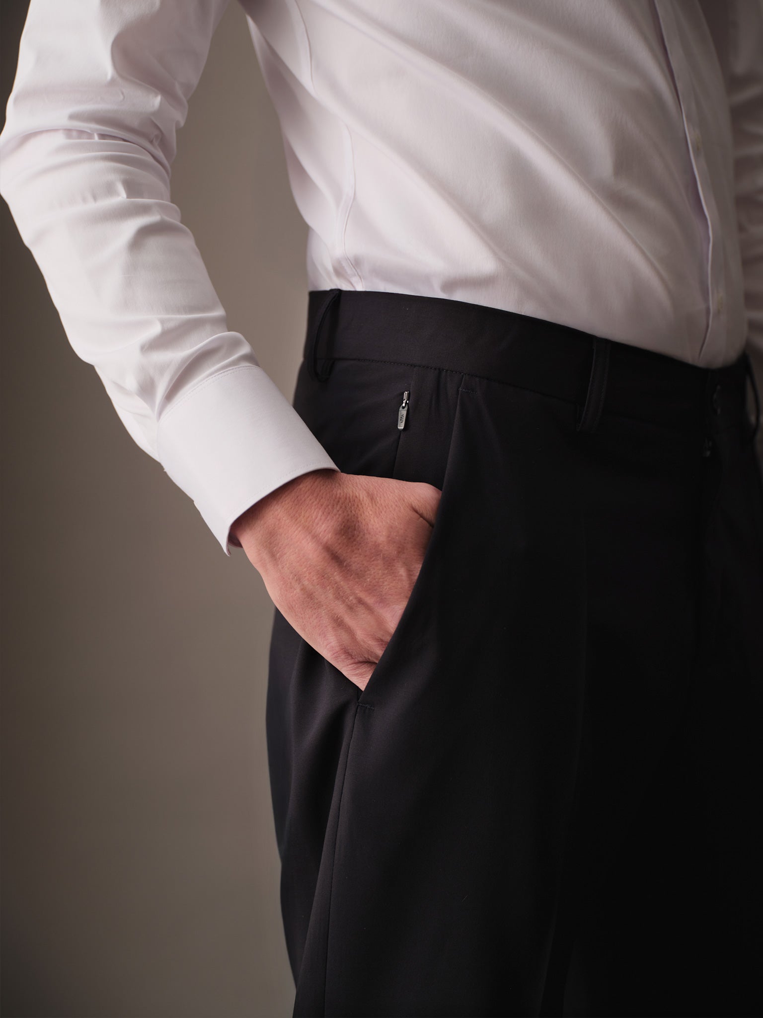 Side pocket detail with concealed zipper on modern pants for men