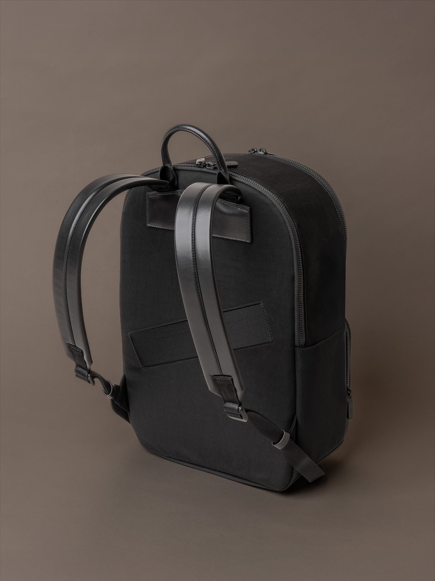 The Boardroom Backpack for men shown as back view with leather straps