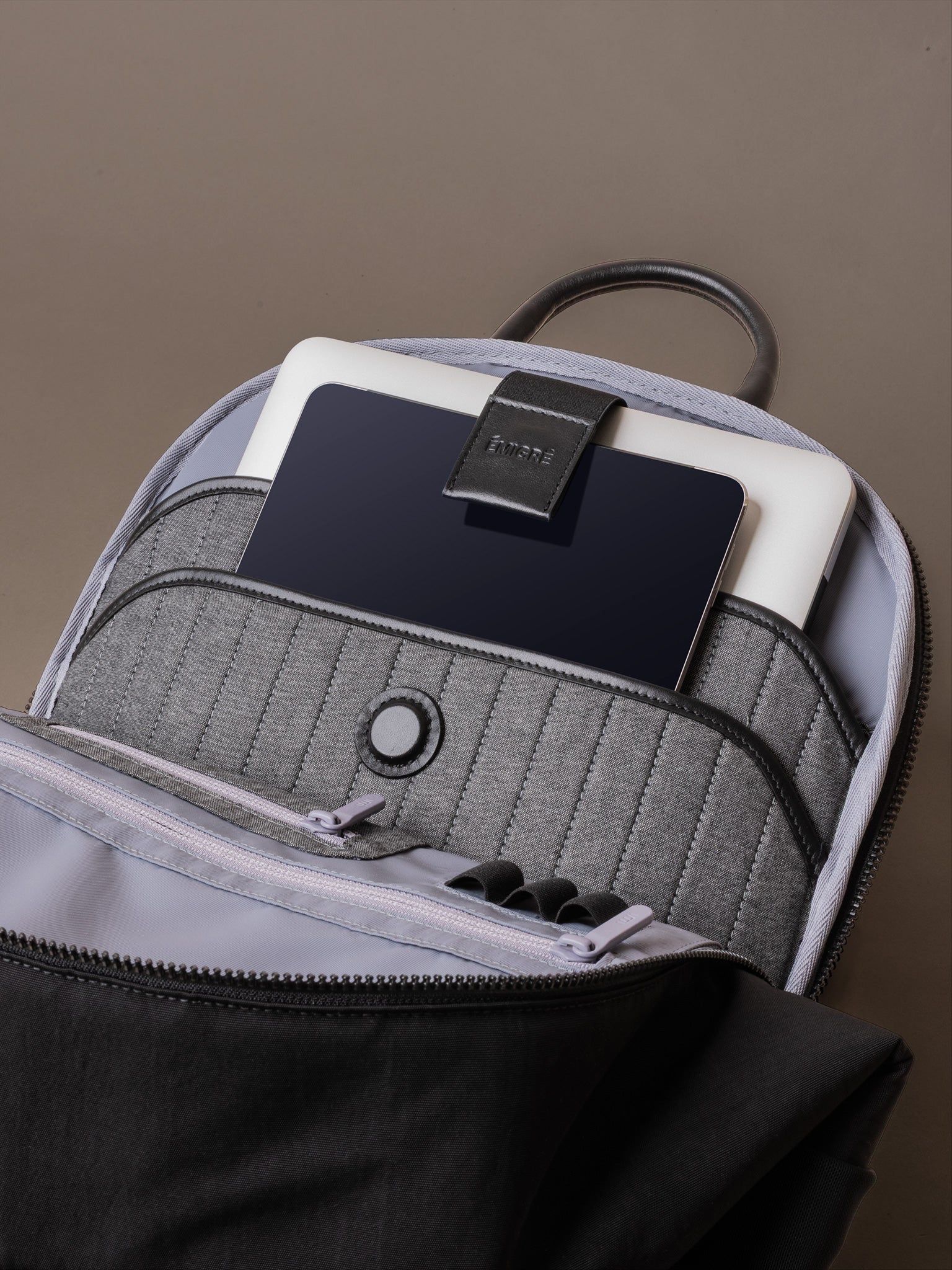 Padded laptop compartment in The Boardroom Backpack fits up to 16 inch device