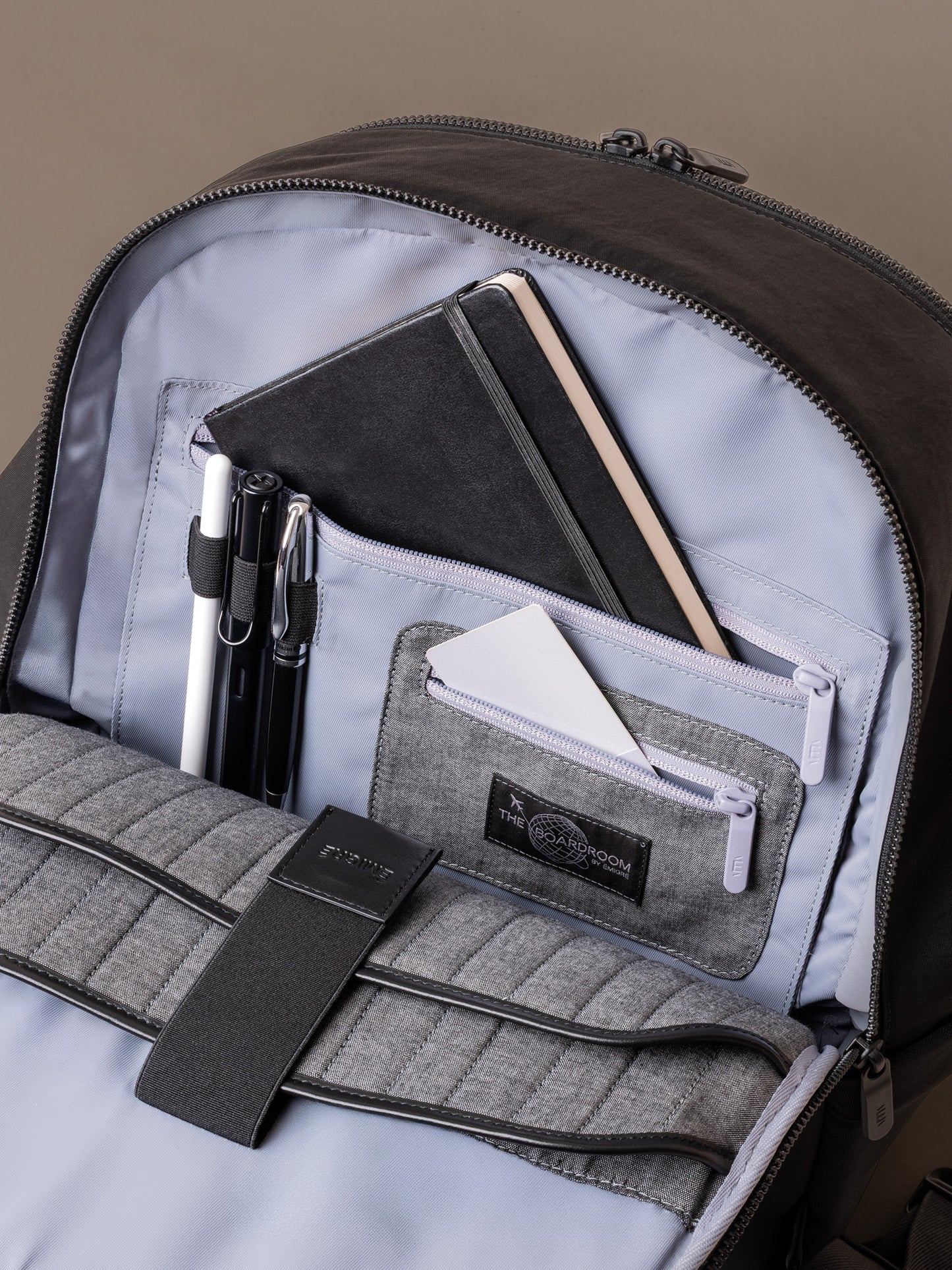 Interior organiser panel in The Boardroom Backpack with notebook pen loops and zip pocket