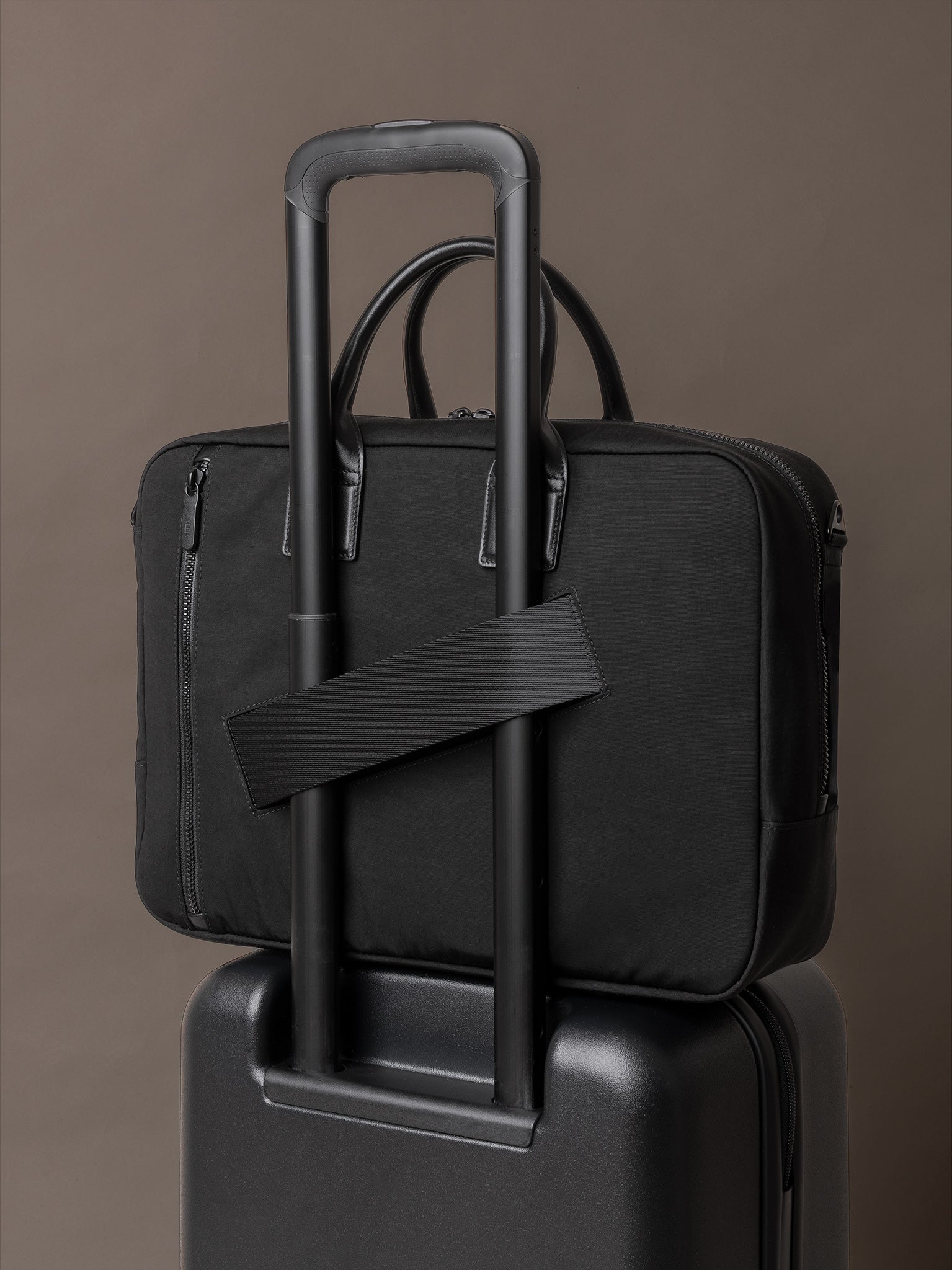 Mens briefcase with luggage sleeve for seamless travel integration and airport transit