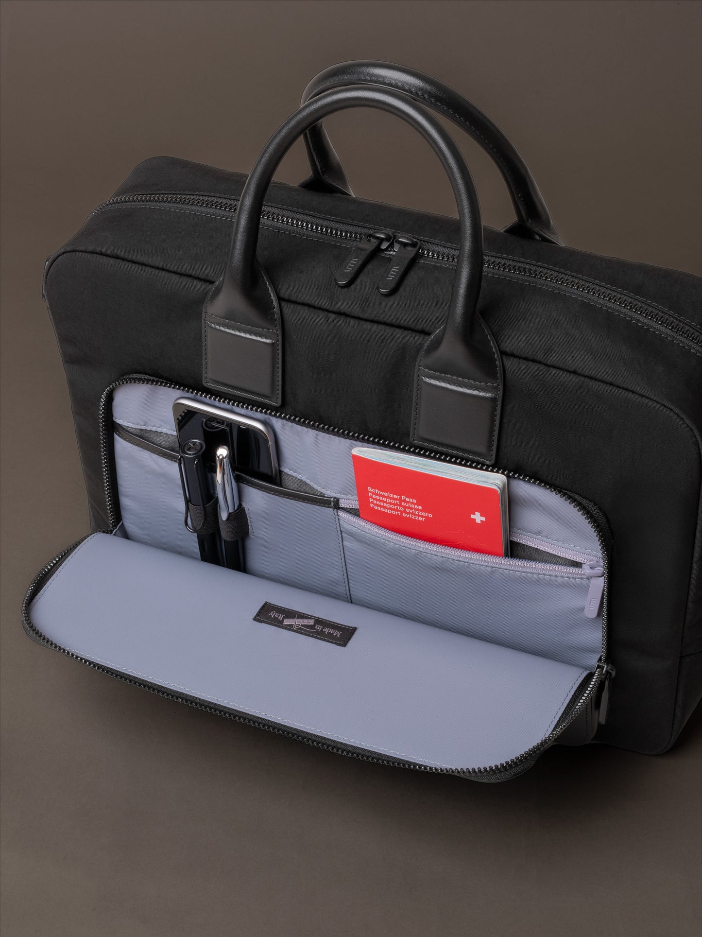 Mens briefcase with front pocket designed for easy access to daily essentials