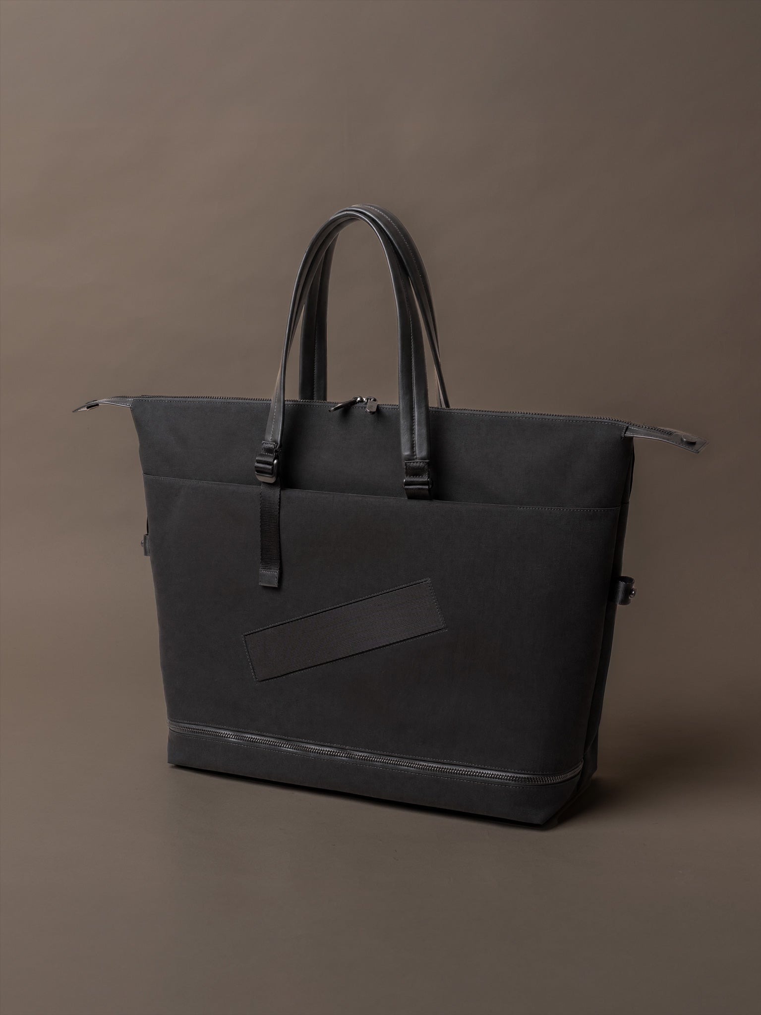 The Studio Tote Bag in black recycled Robic nylon with Italian leather detailing