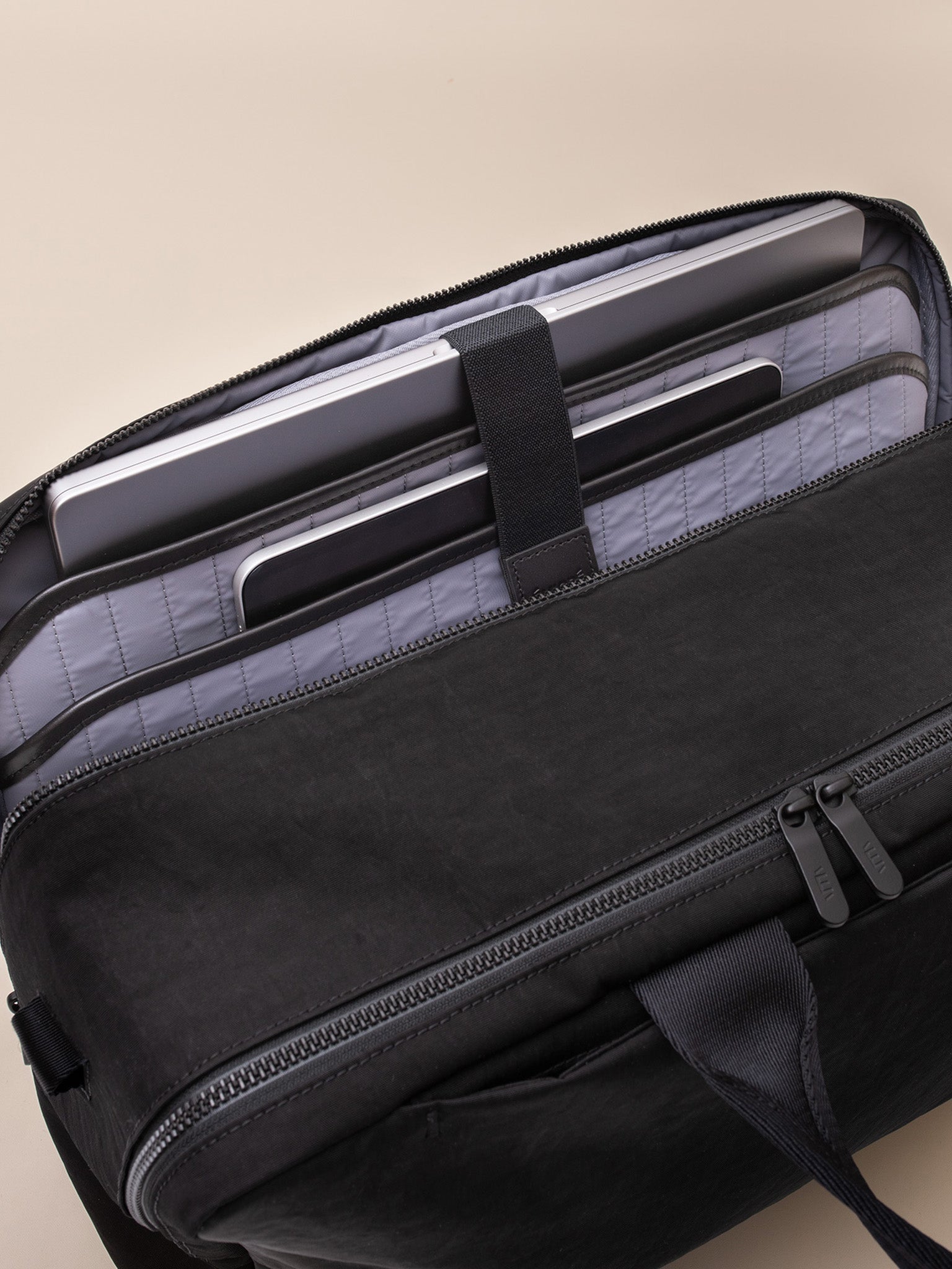 A trendy Boston bag with a minimalist design and adjustable strap.