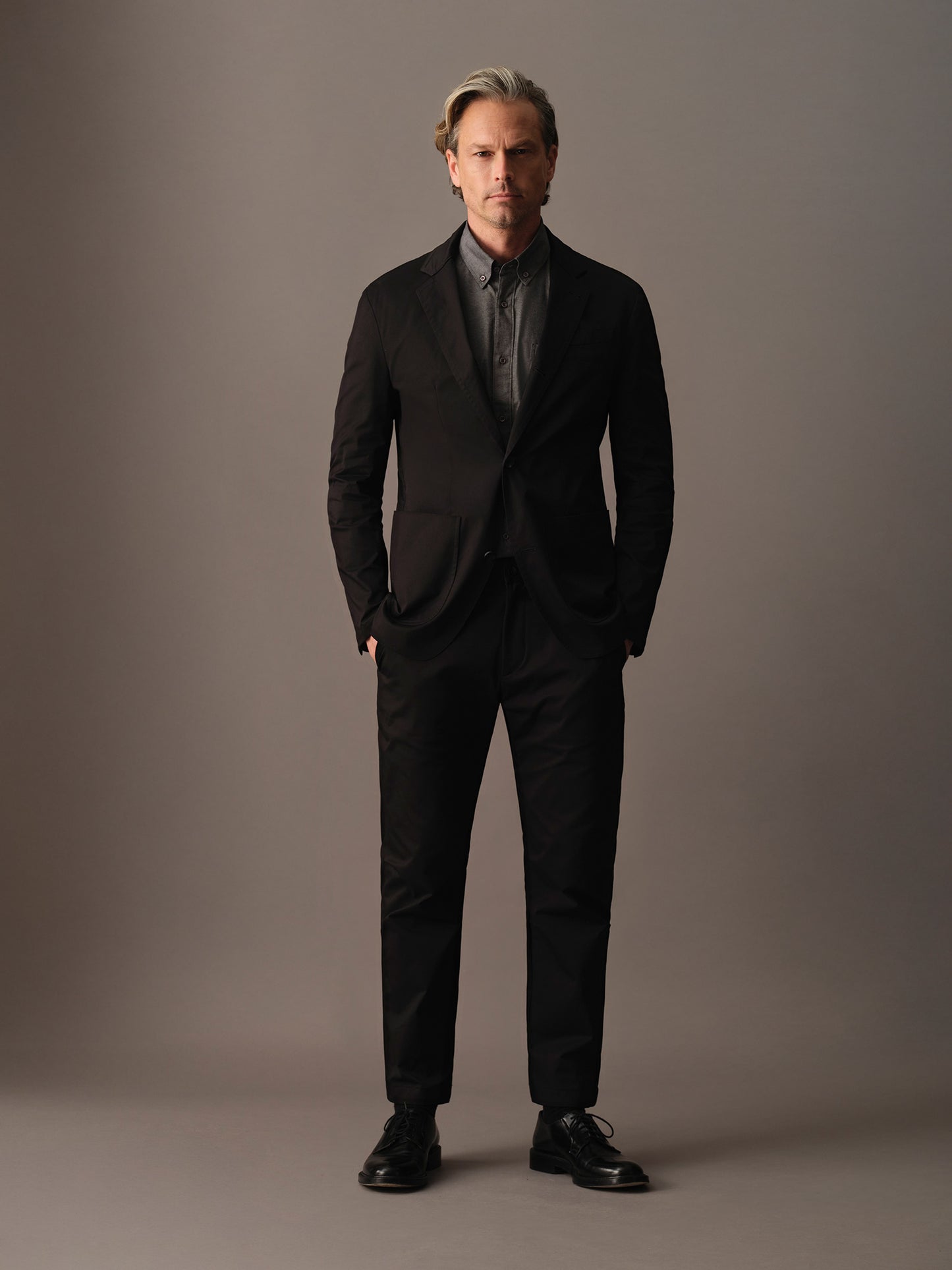 Full-body look featuring men’s cotton blazer styled with matching trousers