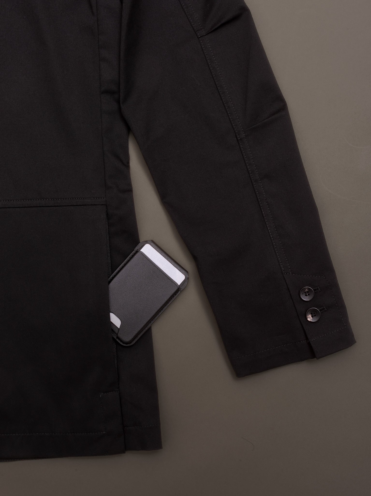 Exterior pocket of men’s cotton blazer holding card holder