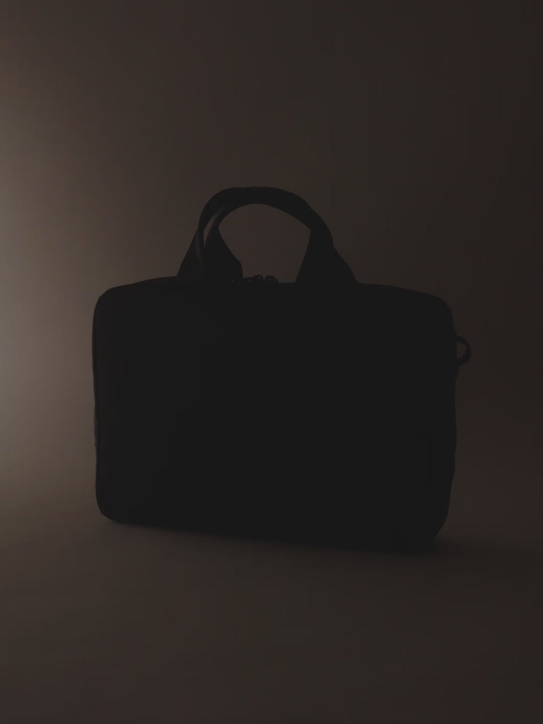 A sophisticated black briefcase for men with a sleek and polished design, suitable for any professional occasion.