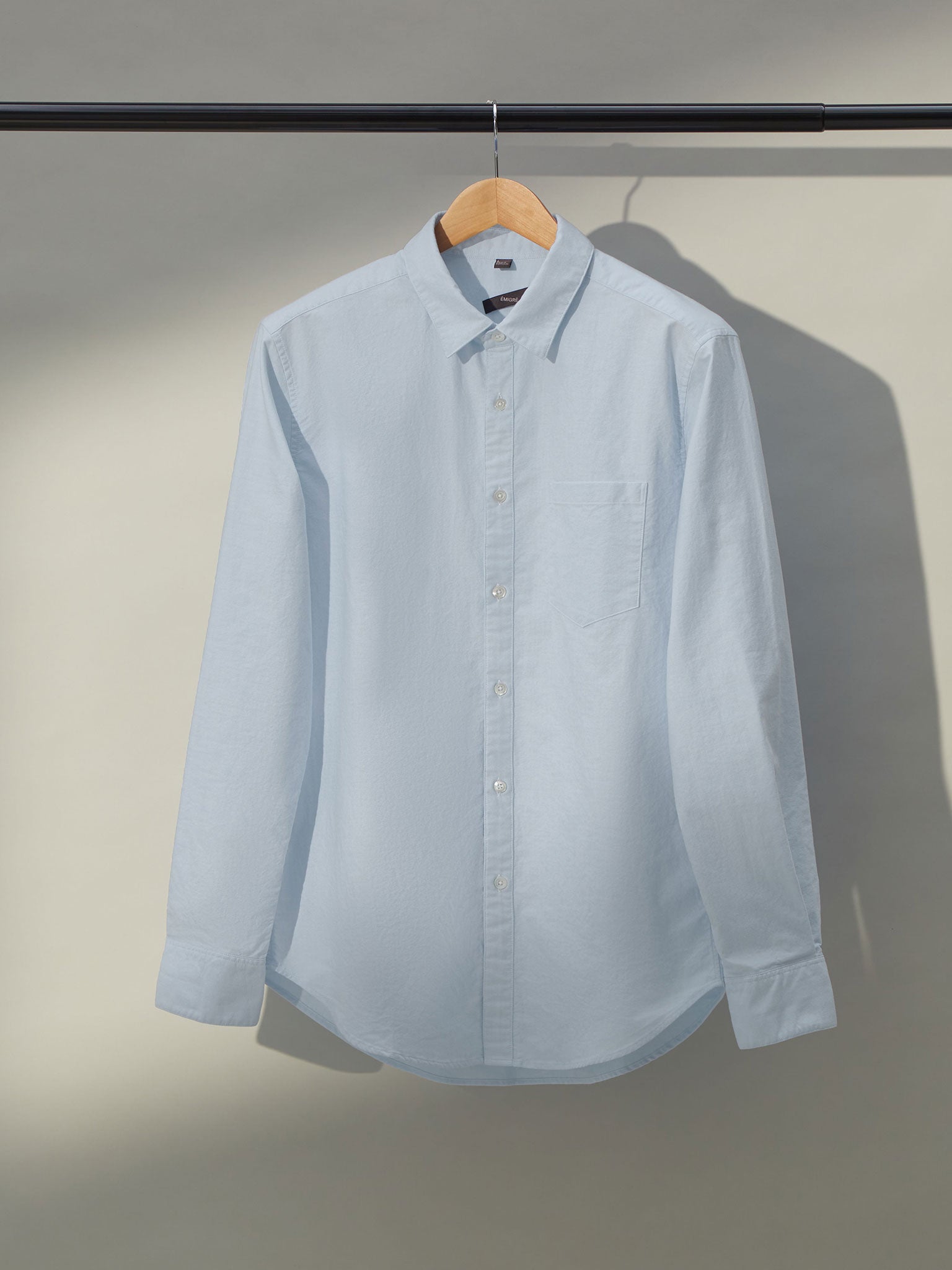 Classic men's blue oxford shirt with button-down collar and chest pocket