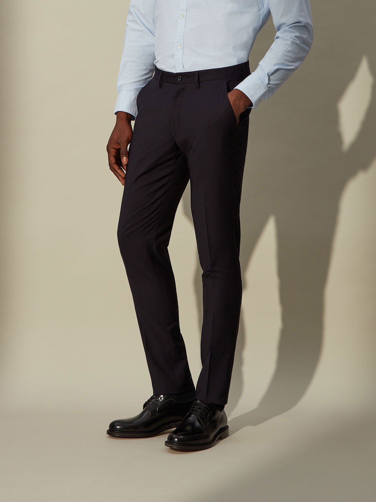 Comfortable men's blue wool trousers with stretch waistband and wrinkle-resistant fabric