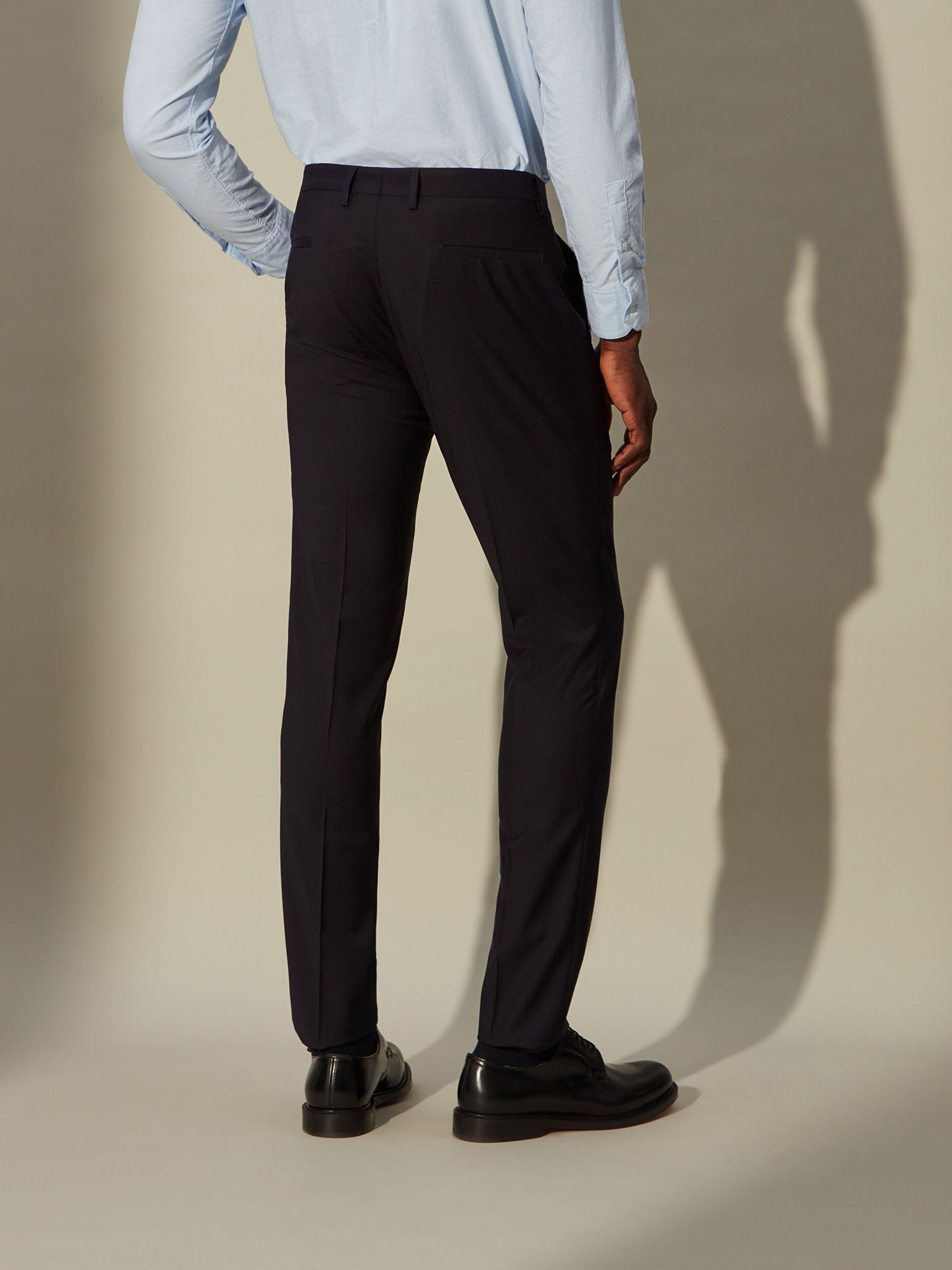blue wool trousers. From the office to your flight to the lobby lounge.