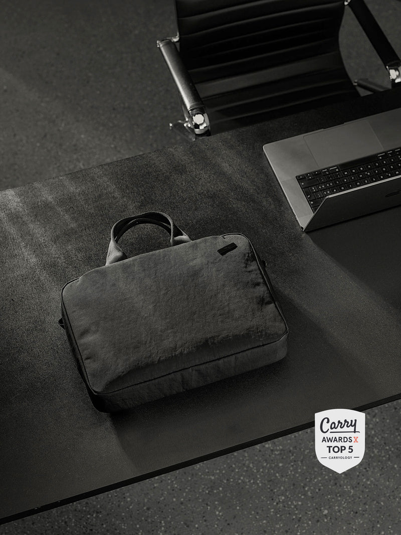 A versatile and spacious briefcase for men with multiple compartments and a stylish design that can be used for work or travel.