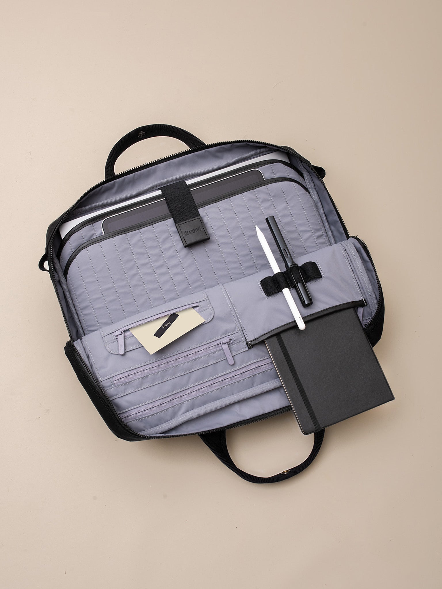 A modern and functional briefcase for men with a padded laptop compartment.
