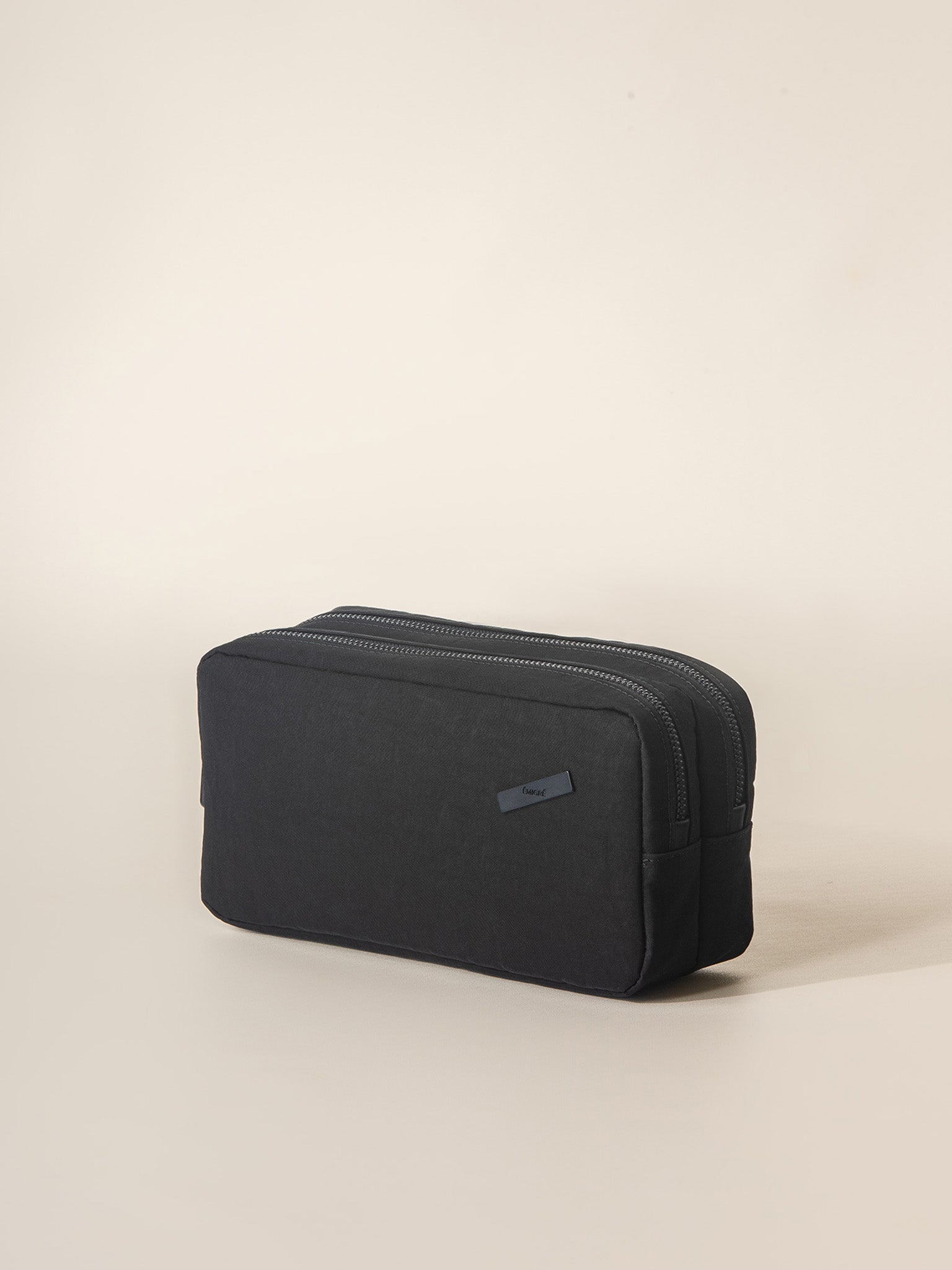 A compact travel washbag for men and women, with multiple compartments for storing toiletries and grooming essentials.